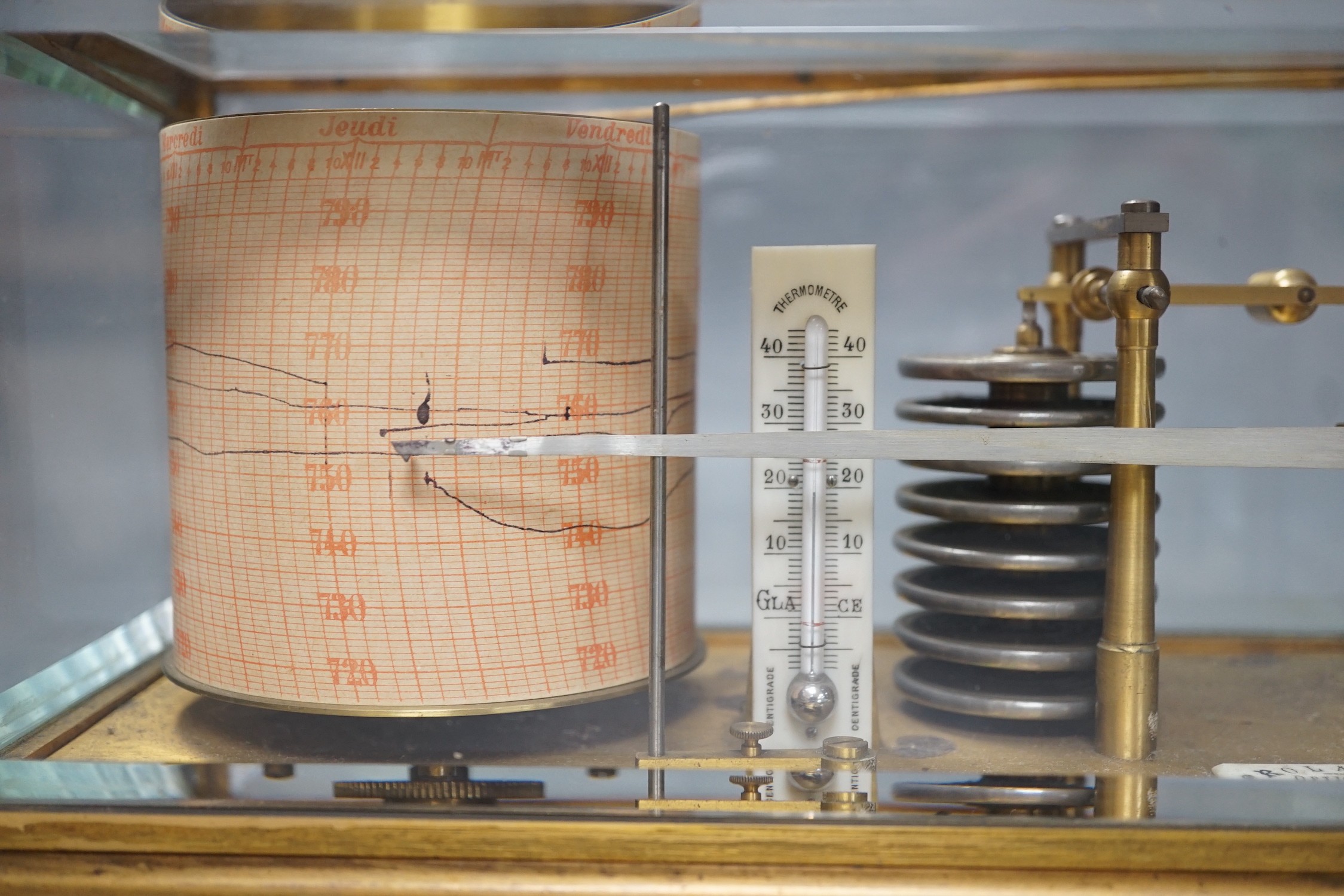 A French brass cased barograph, early 20th century, retailed by Roland, Anvers, number 65830, with ivory thermometer scale and retailers plaque, 30 cm wide